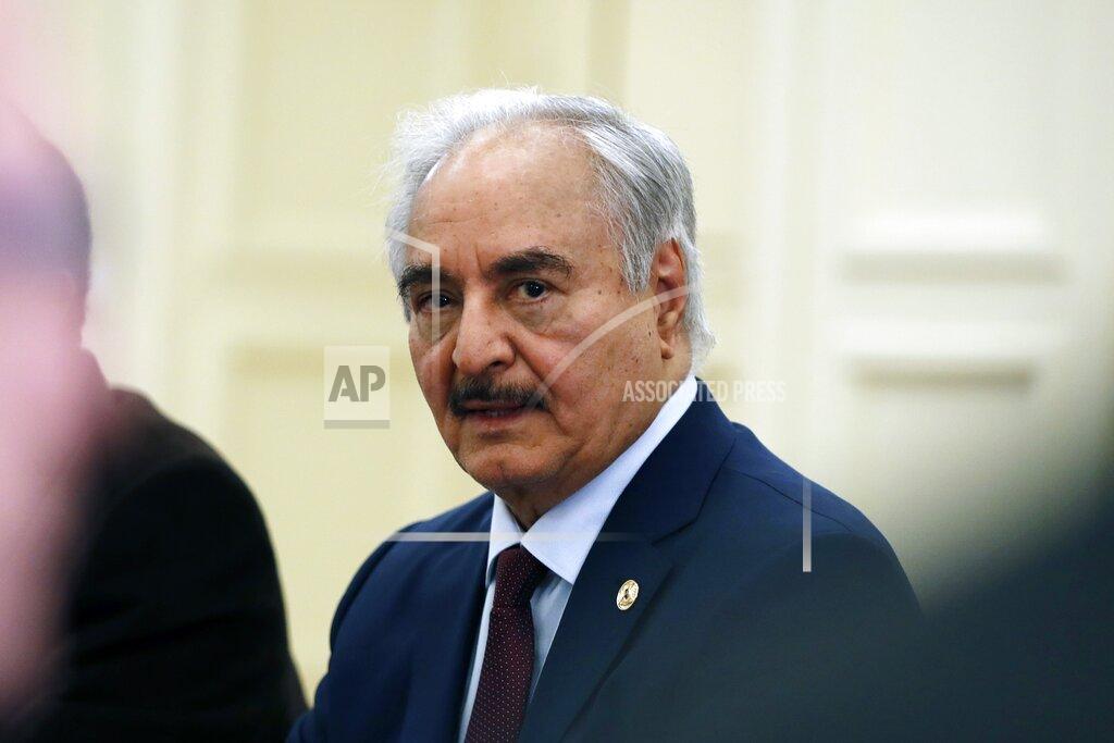 FILE - In this Jan. 17, 2020 file photo, Libyan Gen. Khalifa Hifter joins a meeting with the Greek Foreign Minister Nikos Dendias in Athens. A spokesman said late Wednesday, June 3, 2020, that forces allied with the U.N.-supported government in Libya have captured a key airport in Tripoli from rival troops attempting to take control of the capital for over a year. The fall of Tripoli International Airport came two days after the U.N. announced Libya’s warring parties agreed to resume cease-fire talks following weeks of heavy fighting. Since 2015, Libya has been divided between two governments, one in the east and one in the west. (AP Photo/Thanassis Stavrakis, File)