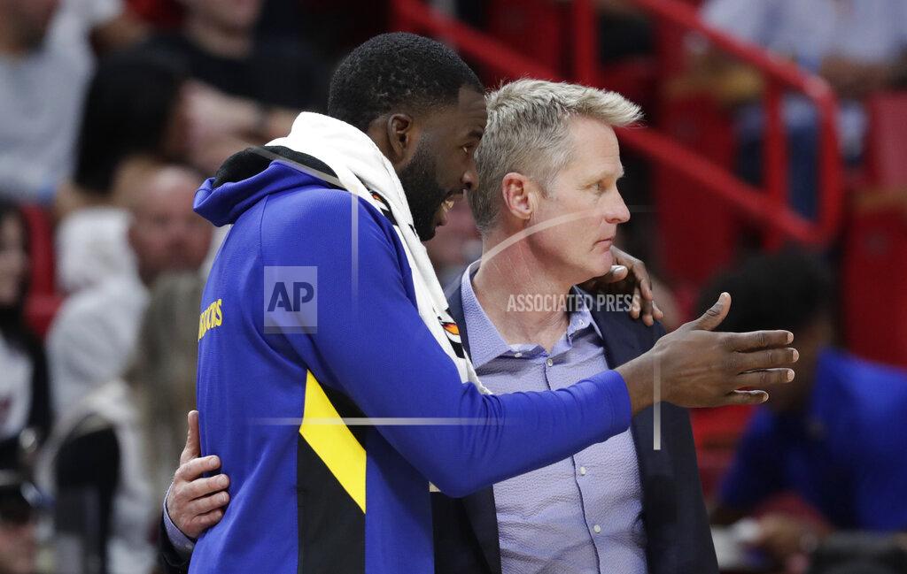 Golden State Warriors forward Draymond Green, left, talks with head coach Steve Kerr during the second half of an NBA basketball game against the Miami Heat, Friday, Nov. 29, 2019, in Miami. (AP Photo/Lynne Sladky)