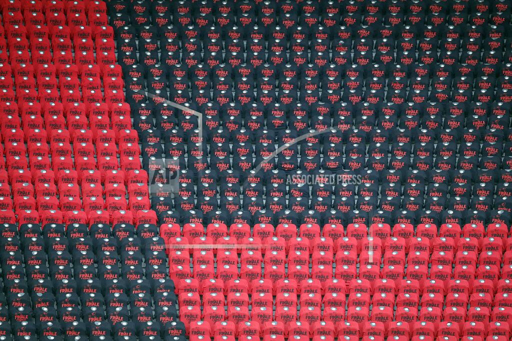 Michael Sohn T-shits reading "Final" are placed over empty seats during the German soccer cup (DFB Pokal) final match between Bayer 04 Leverkusen and FC Bayern Munich in Berlin, Germany, Saturday, July 4, 2020. (AP Photo/Michael Sohn)
