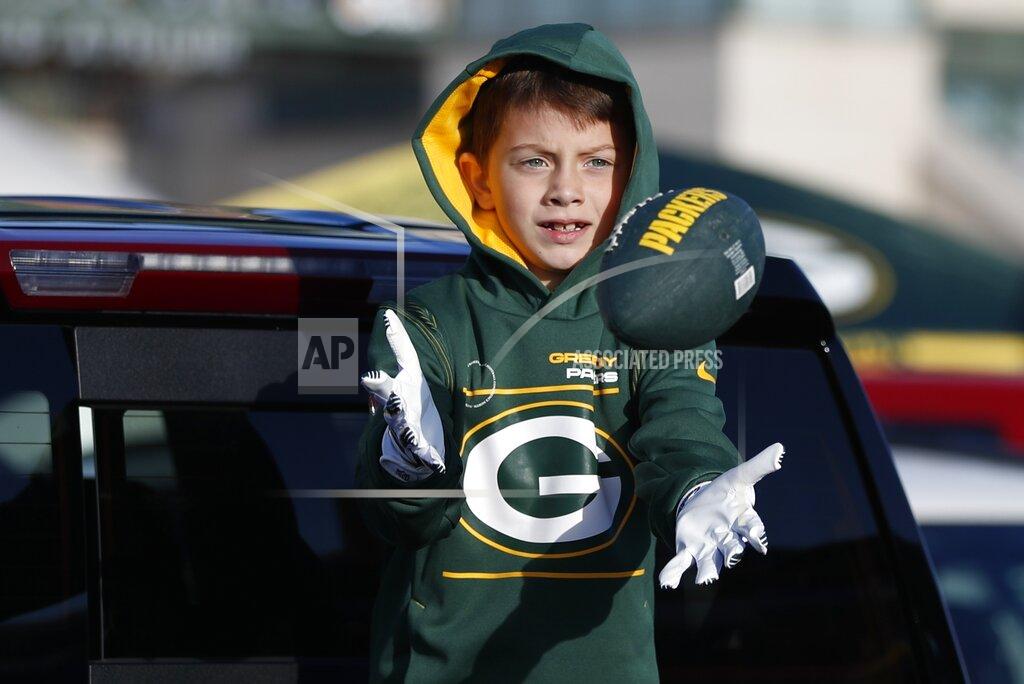 Matt Ludtke Beckett Gould tosses a football outside Lambeau Field before an NFL football game between the Green Bay Packers and the Washington Football Team Sunday, Oct. 24, 2021, in Green Bay, Wis. (AP Photo/Matt Ludtke)