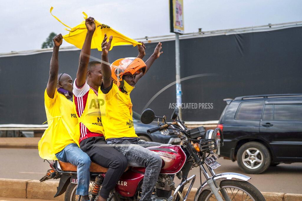 Jerome Delay Supporters of Ugandan President Yoweri Kaguta Museveni celebrate in Kampala, Uganda, Saturday Jan. 16, 2021, after their candidate was declared winner of the presidential elections. Uganda’s electoral commission says longtime President Yoweri Museveni has won a sixth term, while top opposition challenger Bobi Wine alleges rigging and officials struggle to explain how polling results were compiled amid an internet blackout. In a generational clash widely watched across the African continent, the young singer-turned-lawmaker Wine posed arguably the greatest challenge yet to Museveni. (AP Photo/Jerome Delay)