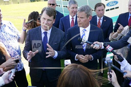 Jim Farley, Ford president and CEO, center left, along with Tennessee Gov. Bill Lee, center right, answers questions along with after a presentation on the planned factory to build electric F-Series trucks and the batteries to power future electric Ford and Lincoln vehicles Tuesday, Sept. 28, 2021, in Memphis, Tenn. The plant in Tennessee is to be built near Stanton, Tenn. (AP Photo/Mark Humphrey)