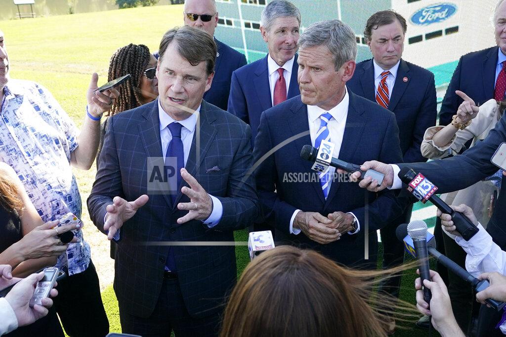 Mark Humphrey Jim Farley, Ford president and CEO, center left, along with Tennessee Gov. Bill Lee, center right, answers questions along with after a presentation on the planned factory to build electric F-Series trucks and the batteries to power future electric Ford and Lincoln vehicles Tuesday, Sept. 28, 2021, in Memphis, Tenn. The plant in Tennessee is to be built near Stanton, Tenn. (AP Photo/Mark Humphrey)