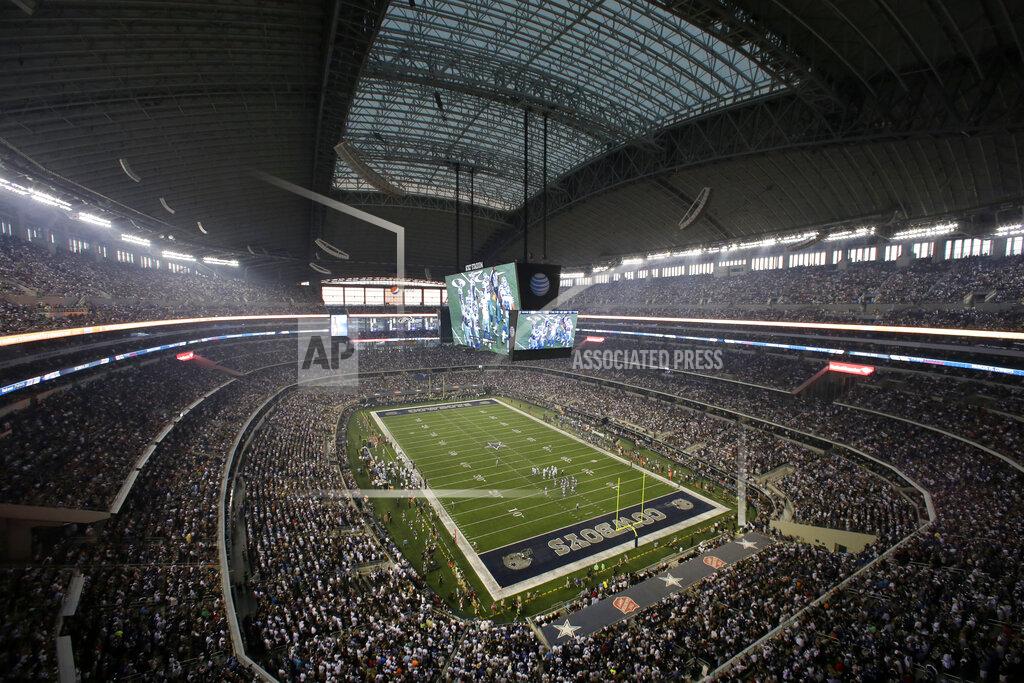 Tony Gutierrez FILE - Fans watch at the start of an NFL football game inside AT&T Stadium between the New York Giants and Dallas Cowboys, Sunday, Sept. 8, 2013, in Arlington, Texas. There are 23 venues bidding to host soccer matches at the 2026 World Cup in the United States, Mexico and Canada. (AP Photo/Tony Gutierrez, File)