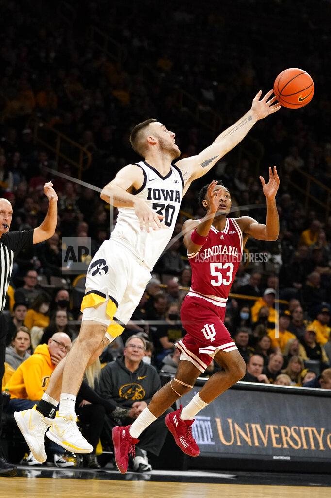 Charlie Neibergall Iowa guard Connor McCaffery (30) steals the ball from Indiana guard Tamar Bates (53) during the first half of an NCAA college basketball game, Thursday, Jan. 13, 2022, in Iowa City, Iowa. (AP Photo/Charlie Neibergall)