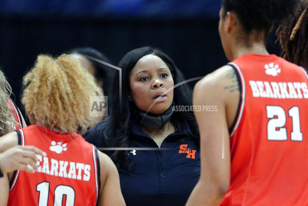 Michael Wyke Sam Houston State head coach Ravon Justice talks with her players during the first half of an NCAA college basketball game against Stephen F. Austin for the Southland Conference women's tournament championship Sunday, March 14, 2021, in Katy, Texas. (AP Photo/Michael Wyke)