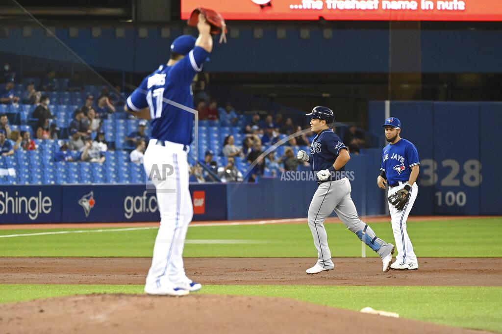 Jon Blacker Tampa Bay Rays' Ji-Man Choi, middle, runs the bases after hitting a solo home run off Toronto Blue Jays starting pitcher Jose Berrios (17) during the second inning of a baseball game Tuesday, Sept. 14, 2021, in Toronto. (Jon Blacker/The Canadian Press via AP)
