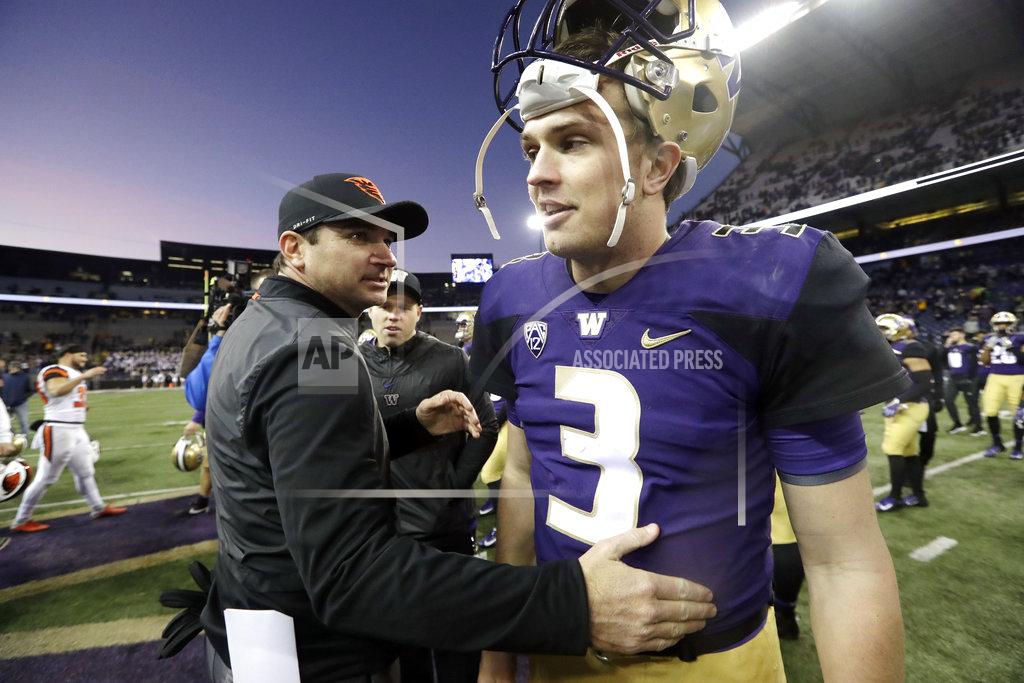 Elaine Thompson Oregon State head coach Jonathan Smith, left, greets Washington quarterback Jake Browning after an NCAA college football game Saturday, Nov. 17, 2018, in Seattle. (AP Photo/Elaine Thompson)