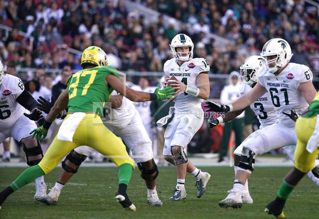 Tony Avelar Michigan State quarterback Brian Lewerke (14) drops back to pass against Oregon during the second half of the Redbox Bowl NCAA college football game Monday, Dec. 31, 2018, in Santa Clara, Calif. (AP Photo/TonyAvelar)