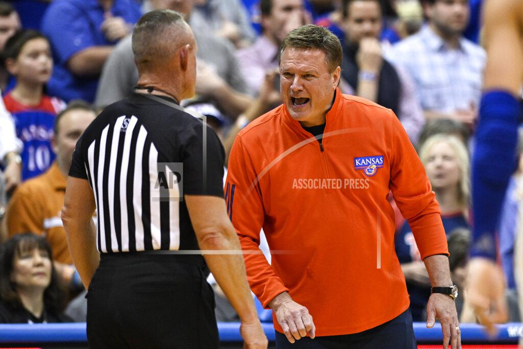 Reed Hoffmann Kansas head coach Bill Self, right, argues a call with an official during the second half of an NCAA college basketball game against Texas in Lawrence, Kan., Saturday, March 5, 2022. (AP Photo/Reed Hoffmann)