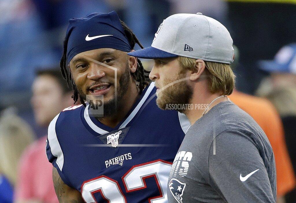 Elise Amendola New England Patriots strong safety Patrick Chung, left, warms up beside Patriots safeties coach Steve Belichick, right, before an NFL preseason football game against the New York Giants, Thursday, Aug. 29, 2019, in Foxborough, Mass. (AP Photo/Elise Amendola)