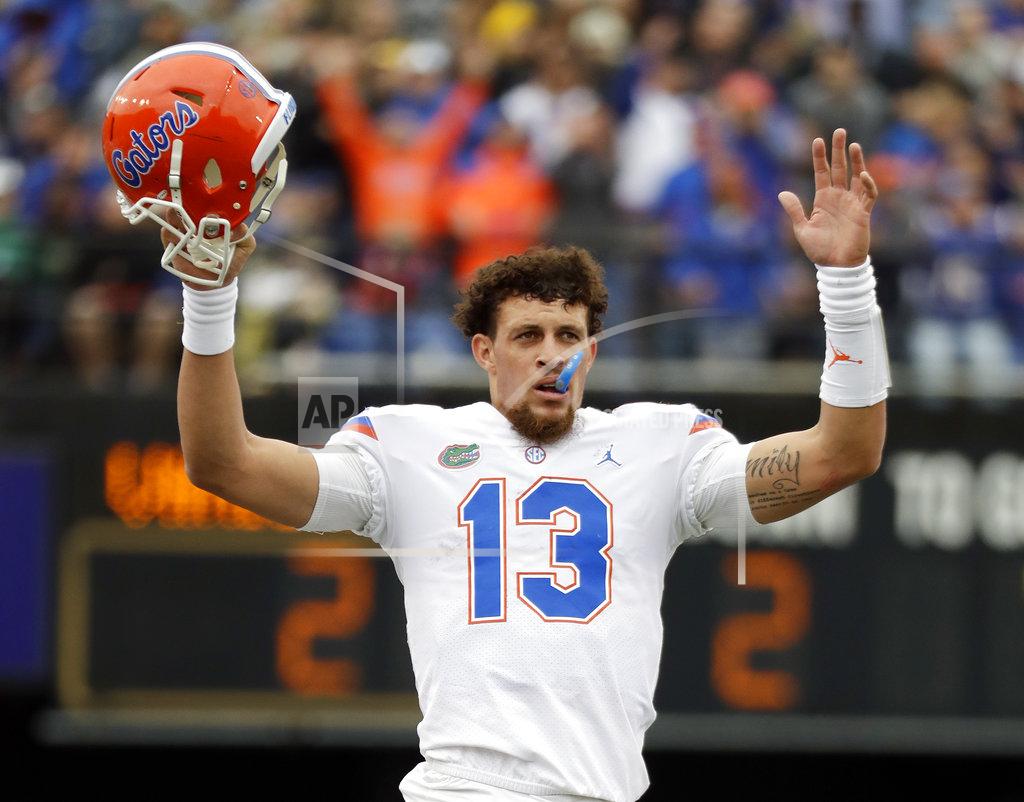 Mark Humphrey CORRECTS TOUCHDOWN BY TEAMMATE LAMICAL PERINE - Florida quarterback Feleipe Franks (13) celebrates after teammate Lamical Perine scored a touchdown against Vanderbilt in the first half of an NCAA college football game Saturday, Oct. 13, 2018, in Nashville, Tenn. (AP Photo/Mark Humphrey)