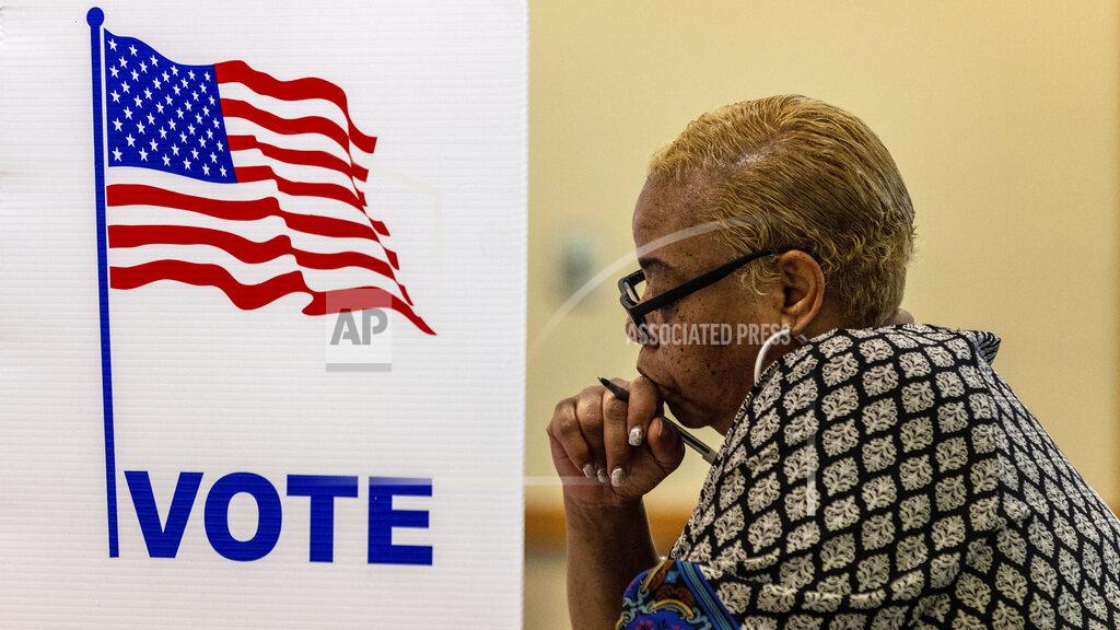 Chris Machian Larnisha Dortch fills out her ballot at Fontenelle Forest during Nebraska's primary election on Tuesday, May 10, 2022, in Bellevue, Neb. (Chris Machian/Omaha World-Herald via AP)