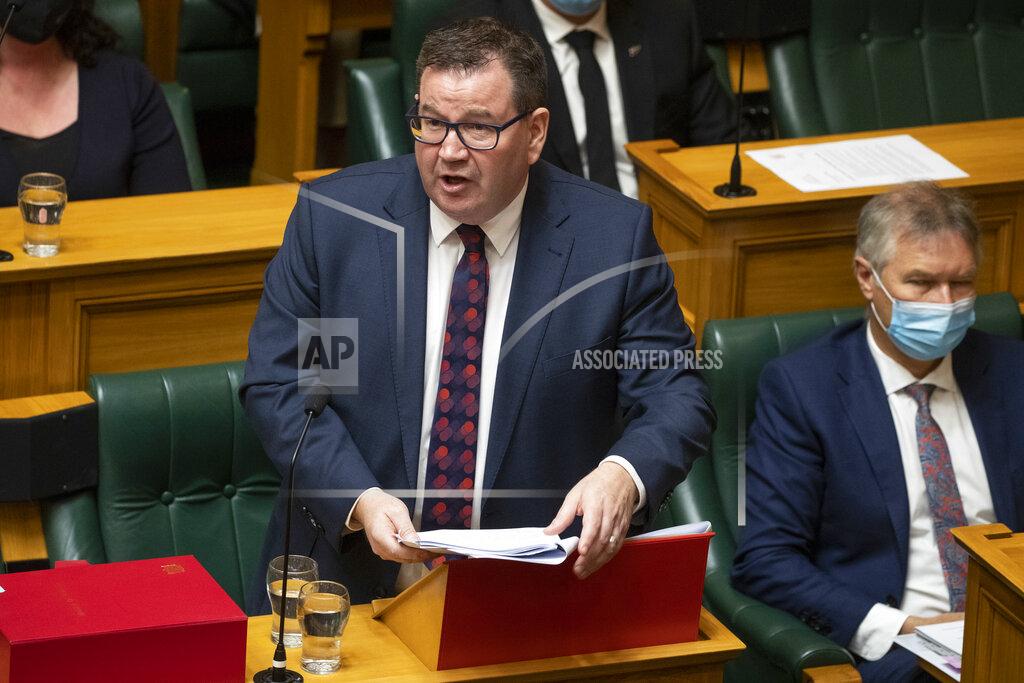Mark Mitchell New Zealand Finance Minister Grant Robertson delivers his Budget speech to parliament in Wellington, New Zealand, Thursday, May 19, 2022. New Zealand's government said Thursday it will hand out an extra few hundred dollars to about half of all adults to help them navigate what it describes as "the peak of the global inflation storm." (Mark Mitchell/NZ Herald via AP)