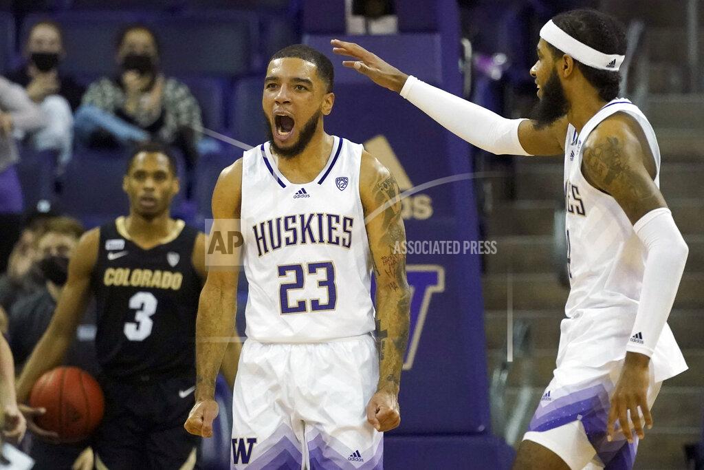 Ted S. Warren Washington guard Terrell Brown Jr. (23) reacts with guard PJ Fuller, right, after making a basket against Colorado during the second half of an NCAA college basketball game, Thursday, Jan. 27, 2022, in Seattle. Washington won 60-58. (AP Photo/Ted S. Warren)