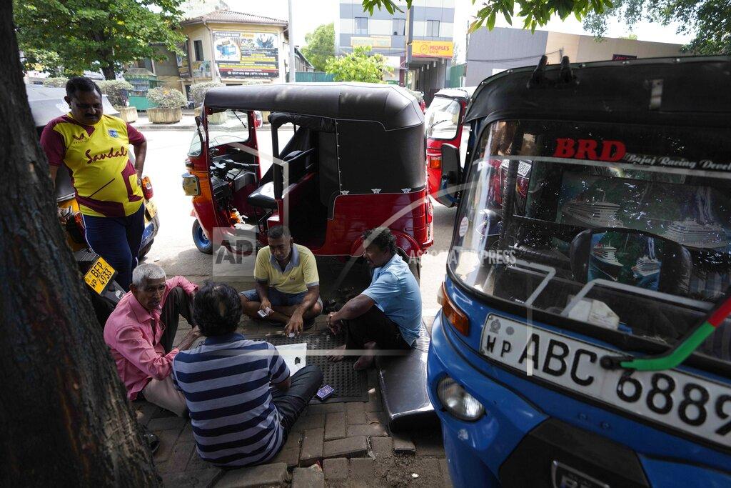 Eranga Jayawardena Auto rickshaw drivers wait to buy fuel in Colombo, Sri Lanka, Tuesday, July 5, 2022. Sri Lanka's ongoing negotiations with the International Monetary Fund have been complex and difficult than the instances before because it has entered talks as a bankrupt nation, the country's prime minister said Tuesday. (AP Photo/Eranga Jayawardena)