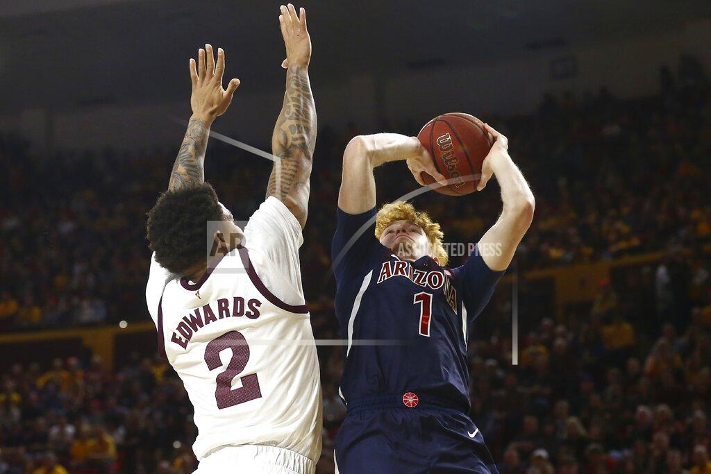 Ross D. Franklin Arizona guard Nico Mannion (1) shoots over Arizona State guard Rob Edwards (2) during the first half of an NCAA college basketball game Saturday, Jan. 25, 2020, in Tempe, Ariz. (AP Photo/Ross D. Franklin)