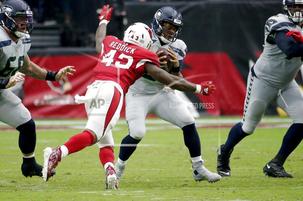 Rick Scuteri Seattle Seahawks quarterback Russell Wilson (3) is sacked by Arizona Cardinals outside linebacker Haason Reddick (43) pursues during the second half of an NFL football game, Sunday, Sept. 29, 2019, in Glendale, Ariz. (AP Photo/Rick Scuteri)