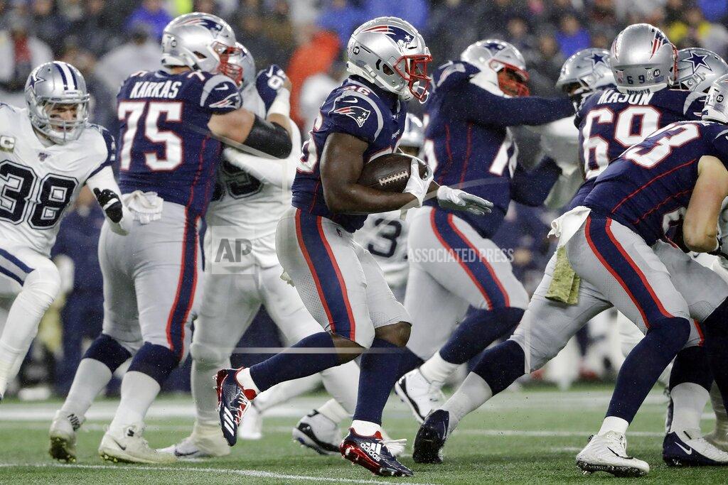 Steven Senne New England Patriots running back Sony Michel carries the ball behind blockers in the first half of an NFL football game against the Dallas Cowboys, Sunday, Nov. 24, 2019, in Foxborough, Mass. (AP Photo/Steven Senne)