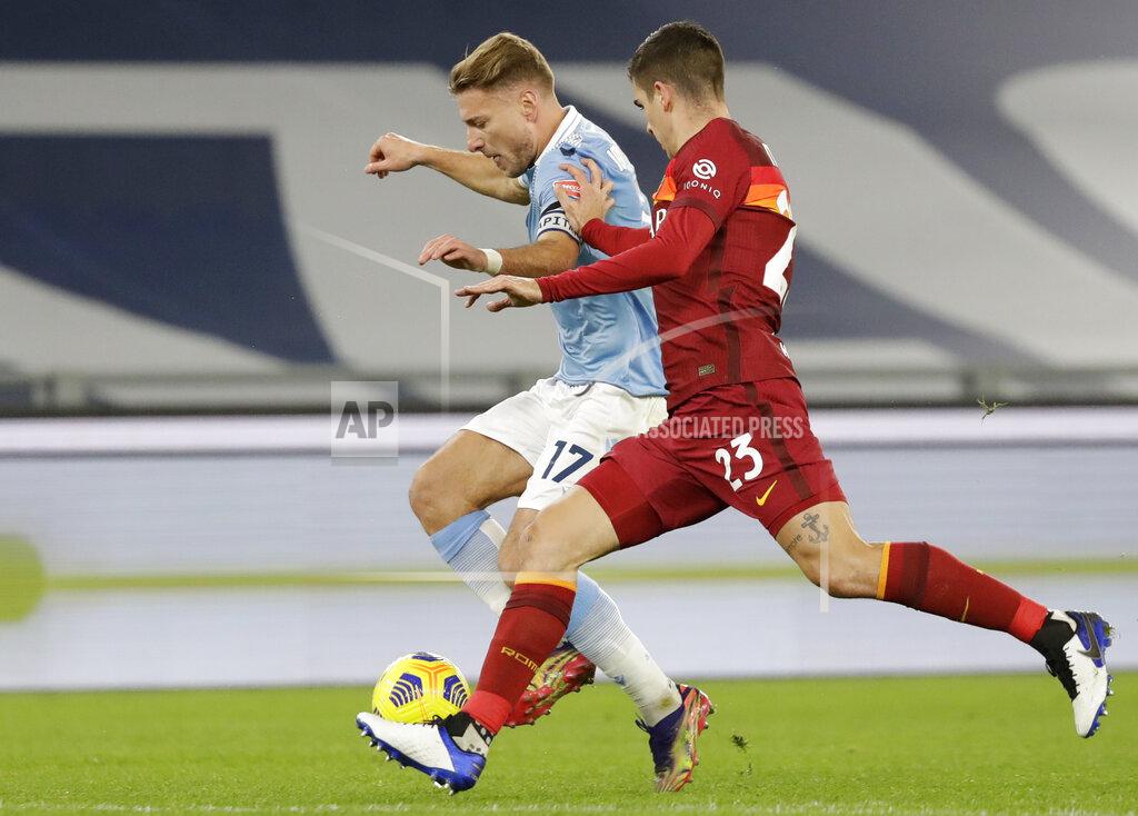 Andrew Medichini Roma's Gianluca Mancini, right, challenges Lazio's Ciro Immobile during the Serie A soccer match between Lazio and Roma, at Rome's Olympic Stadium, Friday, Jan. 15, 2021. (AP Photo/Andrew Medichini)