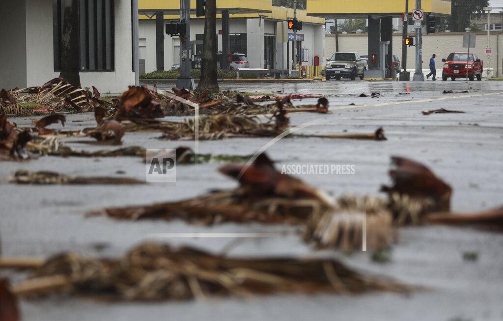 Jon Shapley People get gas the morning after Hurricane Nicholas made landfall along the coast, Tuesday, Sept. 14, 2021, in Galveston, Texas. (Jon Shapley/Houston Chronicle via AP)