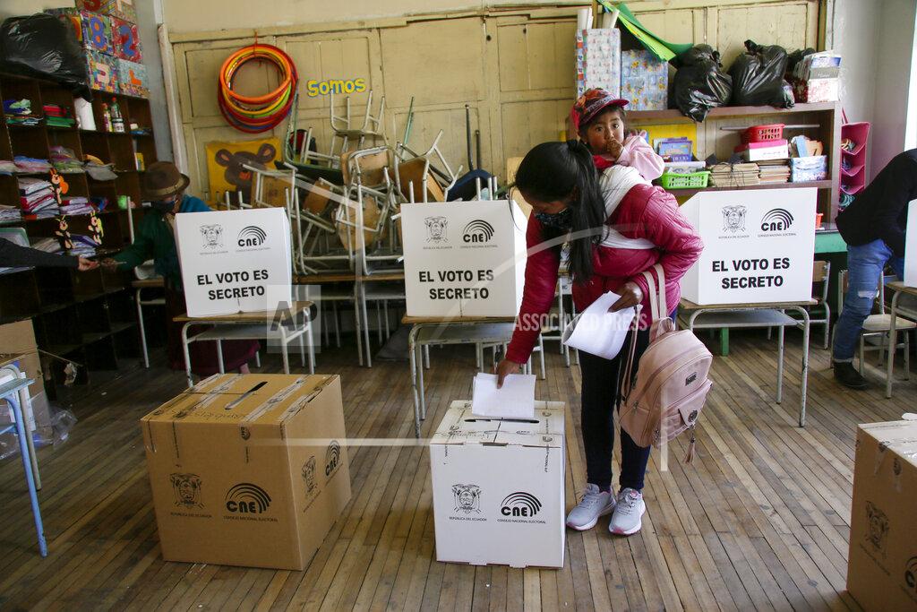 Dolores Ochoa A woman votes in Cangahua, Ecuador, Sunday, Feb. 7, 2021. Amidst the new coronavirus pandemic Ecuadoreans went to the polls in a first round presidential and legislative election. (AP Photo/Dolores Ochoa)
