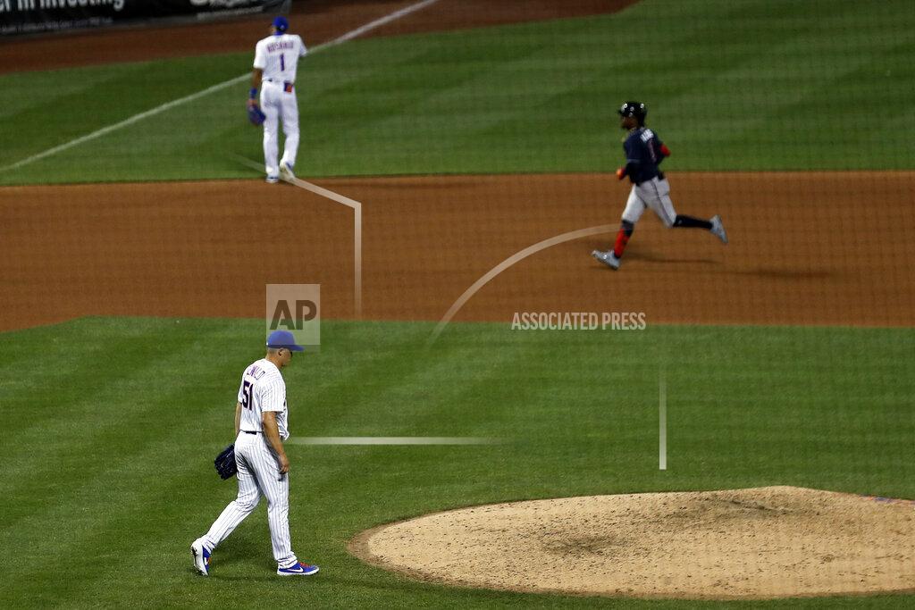 Adam Hunger New York Mets pitcher Paul Sewald (51) walks near the mound after giving up a two-run home run to Atlanta Braves' Ozzie Albies, right, during the seventh inning of a baseball game Sunday, July 26, 2020, in New York. (AP Photo/Adam Hunger)