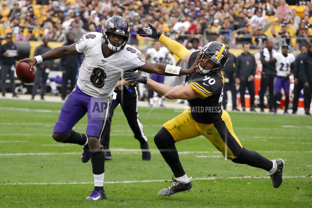 Gene J. Puskar Baltimore Ravens quarterback Lamar Jackson (8) scrambles away from Pittsburgh Steelers outside linebacker T.J. Watt (90) in the first half of an NFL football game, Sunday, Oct. 6, 2019, in Pittsburgh. (AP Photo/Gene J. Puskar)