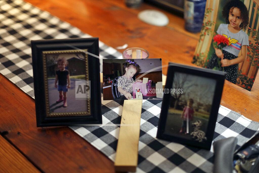 Dario Lopez-Mills Photos of Layla Salazar are displayed on a table of her home in Uvalde, Texas Thursday, May 26, 2022. Layla Salazar was one of the 19 children and their two teachers who were gunned down behind a barricaded door at Robb Elementary School. Each morning as he drove her to school in his pickup, Salazar would play "Sweet Child O' Mine," by Guns N' Roses and they'd sing along, he said. (AP Photo/Dario Lopez-Mills)