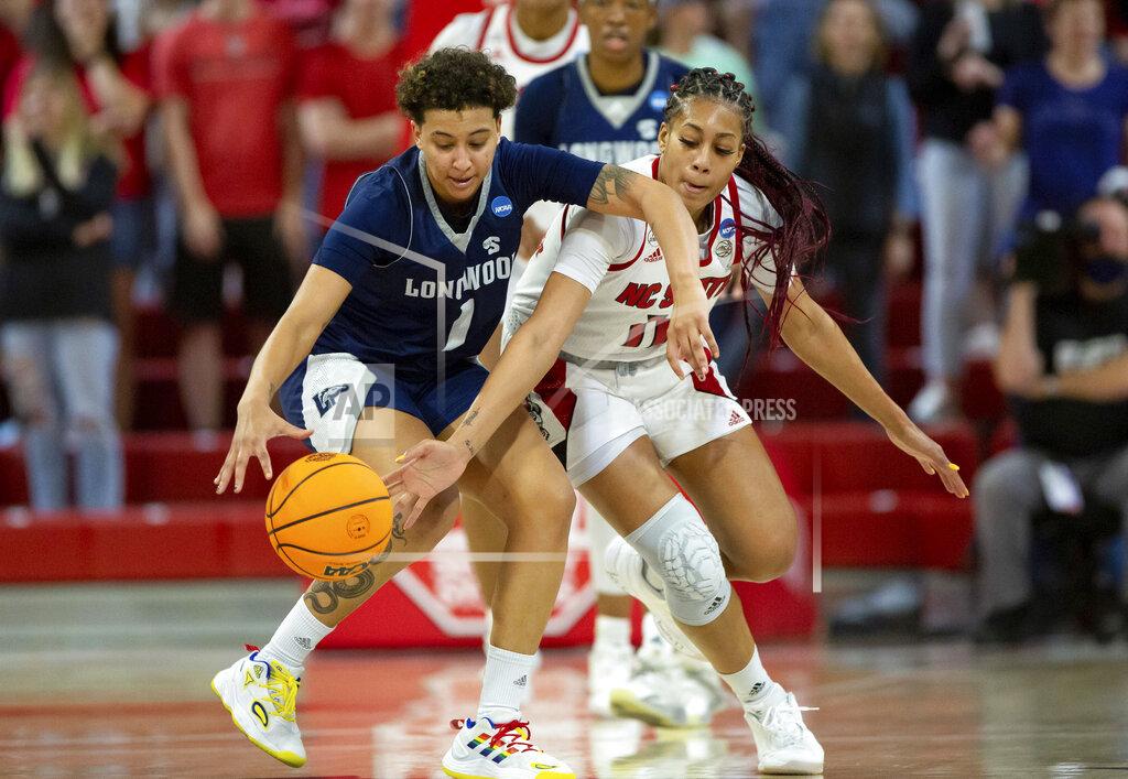 Ben Mckeown Longwood's Kyla McMakin (1) and North Carolina State's Jakia Brown-Turner (11) battle for a loose ball during a college basketball game in the first round of the NCAA tournament in Raleigh, N.C., Saturday, March 19, 2022. (AP Photo/Ben McKeown)