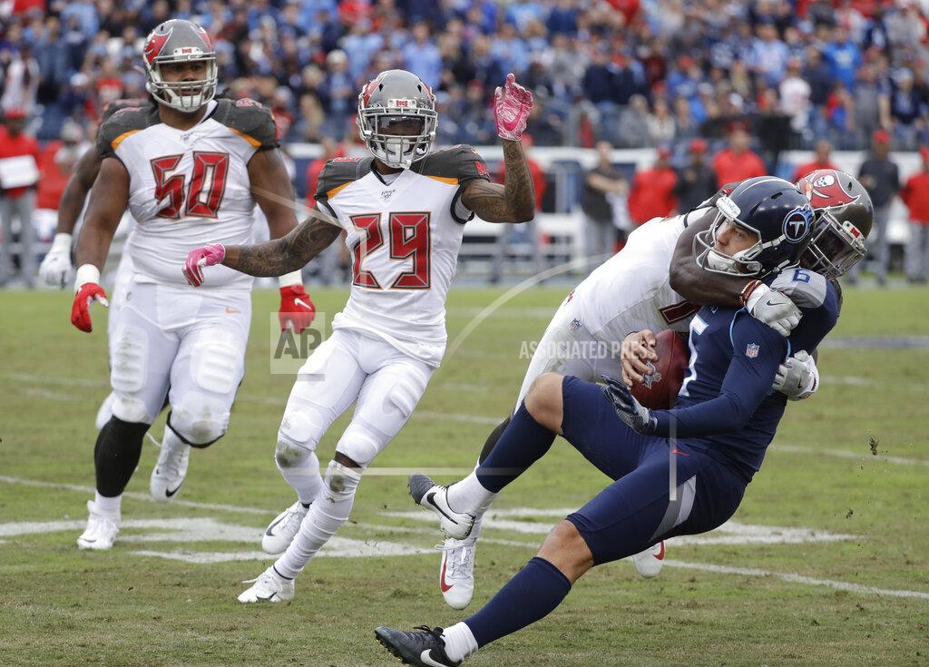 James Kenney Tennessee Titans kick holder Brett Kern (6) is brought down by Tampa Bay Buccaneers linebacker Devin White on a fake field goal play in the second half of an NFL football game Sunday, Oct. 27, 2019, in Nashville, Tenn. (AP Photo/James Kenney)