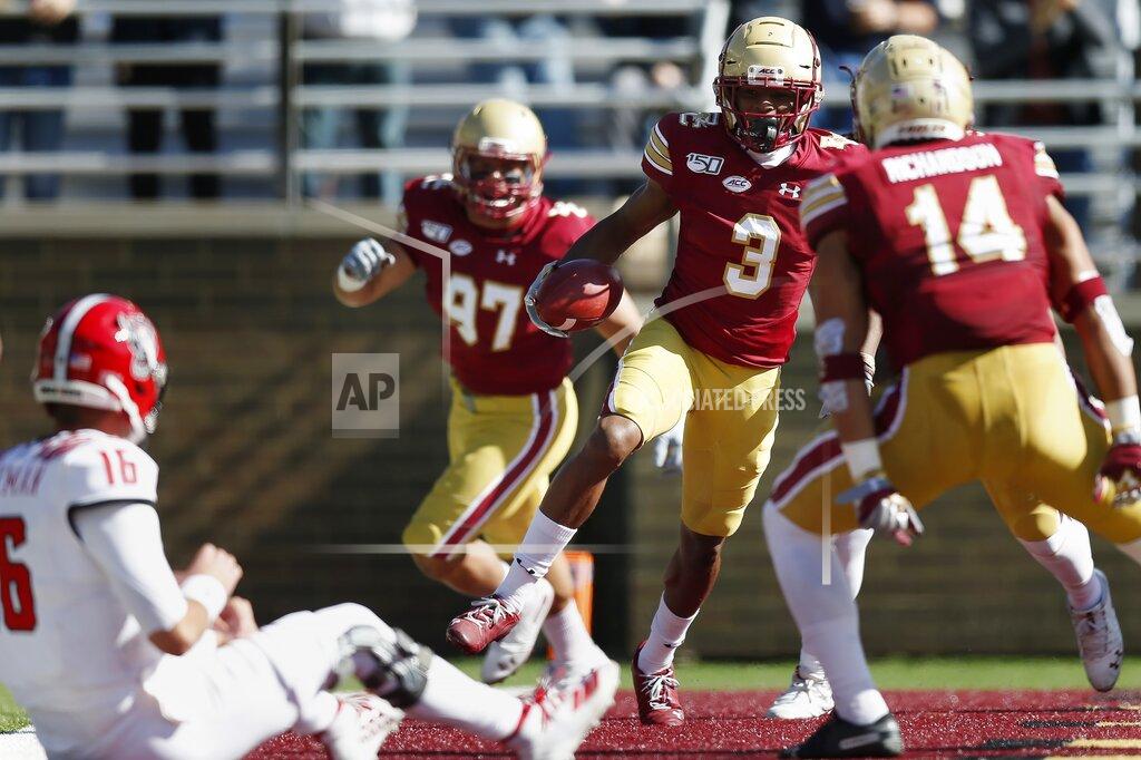 Michael Dwyer North Carolina State quarterback Bailey Hockman (16) watches as Boston College defensive back Jason Maitre (3) celebrates his interception and touchdown during the first half of an NCAA college football game in Boston, Saturday, Oct. 19, 2019. (AP Photo/Michael Dwyer)
