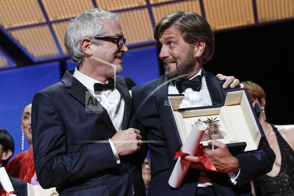 Joel C Ryan Alfonso Cuaron, left, poses with writer/director Ruben Ostlund, winner of the Palme d'Or for 'Triangle of Sadness' during the awards ceremony of the 75th international film festival, Cannes, southern France, Saturday, May 28, 2022. (Photo by Joel C Ryan/Invision/AP)