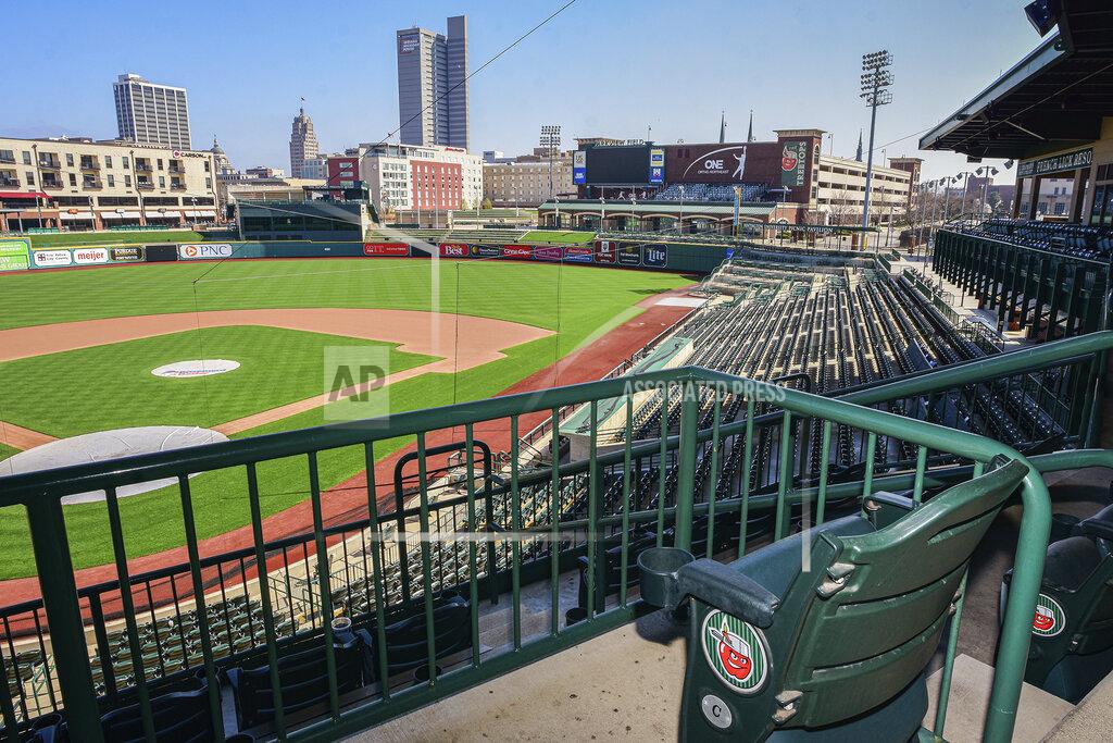 Mike Moore Downtown Fort Wayne, Ind., is seen from an empty Parkview Field on Wednesday, April 8, 2020. Mike Nutter is surrounded by questions everywhere he goes these days. So the longtime president of the Fort Wayne TinCaps is planning for every scenario he can imagine, one at a time. While Major League Baseball tries to figure out a way to play this summer, the prospects for anything resembling a normal minor league season are looking increasingly bleak. For minor league communities across the country, looking forward to cheap hot dogs, fuzzy mascot hugs and various theme nights, it's a small slice of a depressing picture. (Mike Moore/The Journal-Gazette via AP)