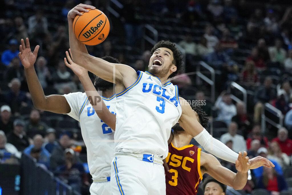 John Locher UCLA's Johnny Juzang (3) grabs a rebound Southern California's Isaiah Mobley, right, during the second half of an NCAA college basketball game in the semifinal round of the Pac-12 tournament Friday, March 11, 2022, in Las Vegas. (AP Photo/John Locher)