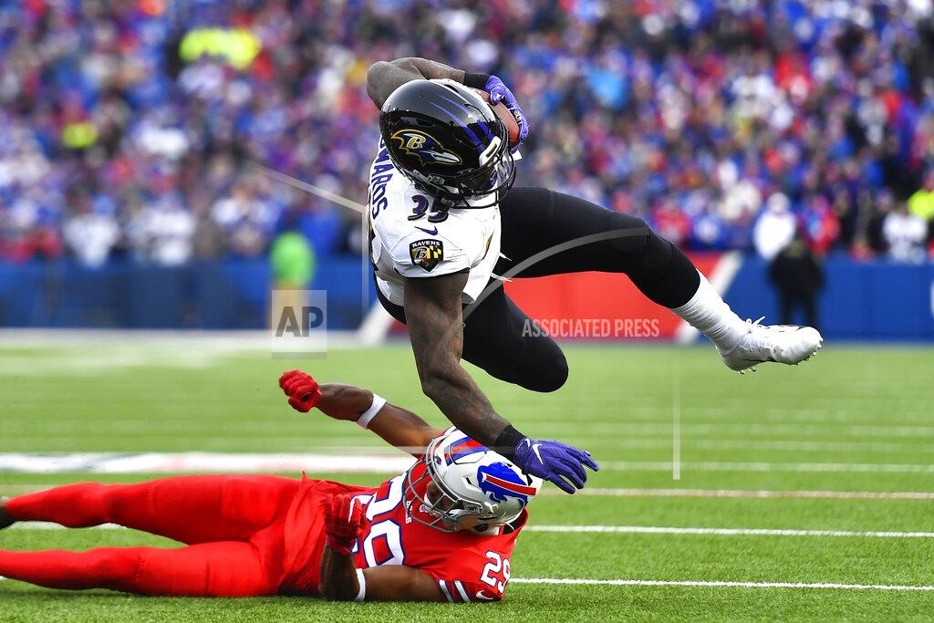 Adrian Kraus Baltimore Ravens running back Gus Edwards (35) is upend by Buffalo Bills cornerback Kevin Johnson (29) during the second half of an NFL football game in Orchard Park, N.Y., Sunday, Dec. 8, 2019. (AP Photo/Adrian Kraus)
