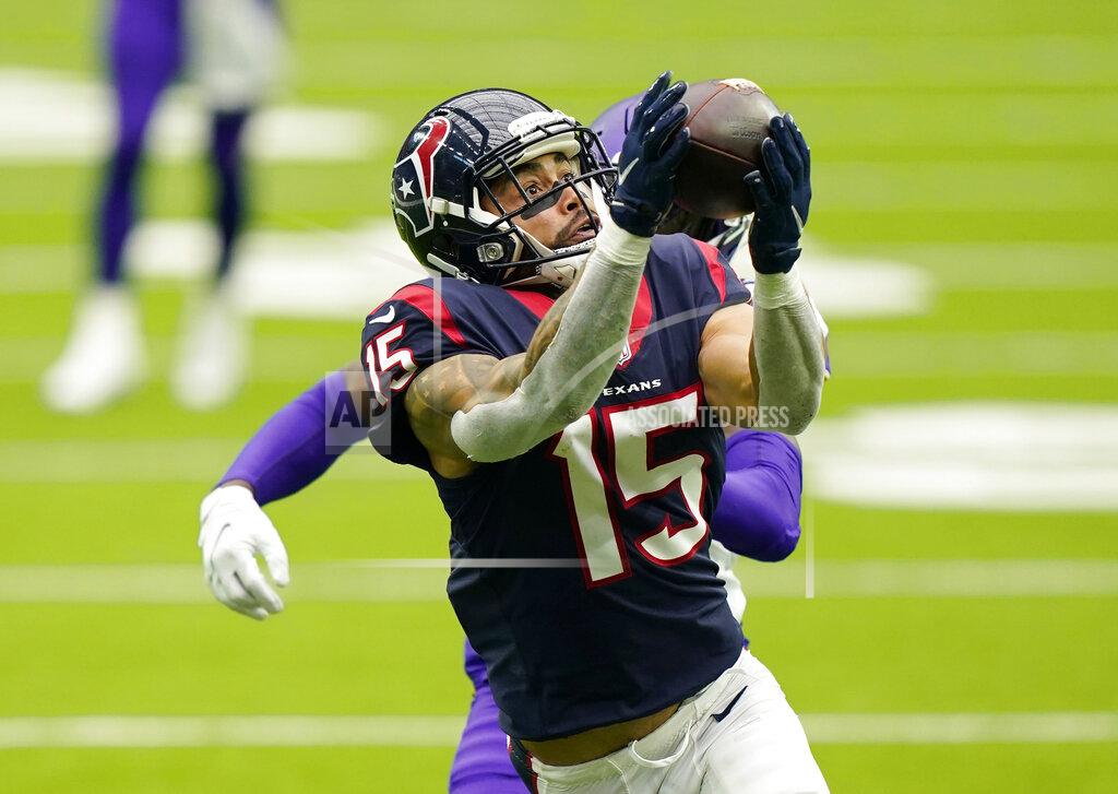David J. Phillip Houston Texans wide receiver Will Fuller (15) makes a catch for a first down in front of Minnesota Vikings cornerback Jeff Gladney (20) during the second half of an NFL football game Sunday, Oct. 4, 2020, in Houston. (AP Photo/David J. Phillip)