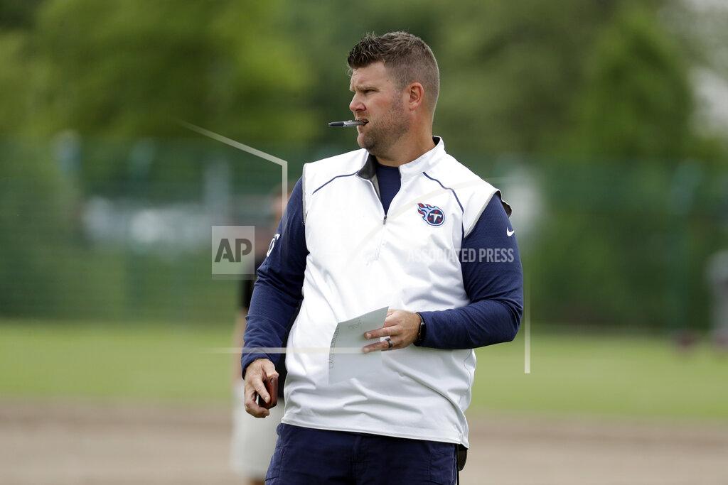 Mark Humphrey FILE - In this June 12, 2019, file photo, Tennessee Titans general manager Jon Robinson watches players during an organized team activity at the Titans' NFL football training facility in Nashville, Tenn. Thanks to an unexpected run to their first AFC championship game in 17 years, the Titans hold the No. 29 overall pick in the upcoming NFL draft. It's the latest they've selected since 2008 when they last won the AFC South title. (AP Photo/Mark Humphrey, File)