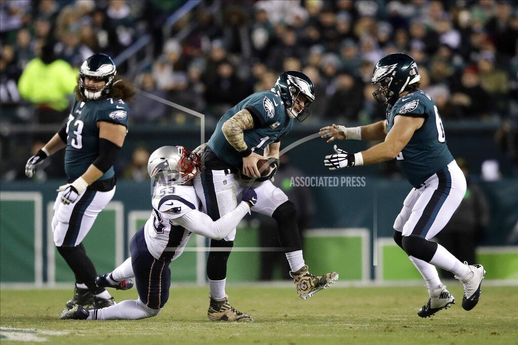Matt Rourke New England Patriots' Kyle Van Noy (53) tackles Philadelphia Eagles' Carson Wentz (11) during the first half of an NFL football game, Sunday, Nov. 17, 2019, in Philadelphia. (AP Photo/Matt Rourke)