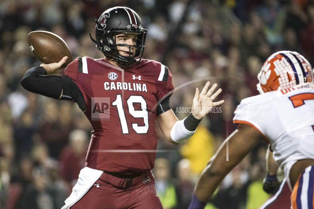 Sean Rayford FILE - In this Nov. 25, 2017, file photo, South Carolina quarterback Jake Bentley (19) attempts a pass against Clemson during the first half of an NCAA college football game, in Columbia, S.C. South Carolina’s Will Muschamp believes he’s got the strongest, deepest and most talented team in his four seasons as the Gamecocks’ coach. (AP Photo/Sean Rayford, File)