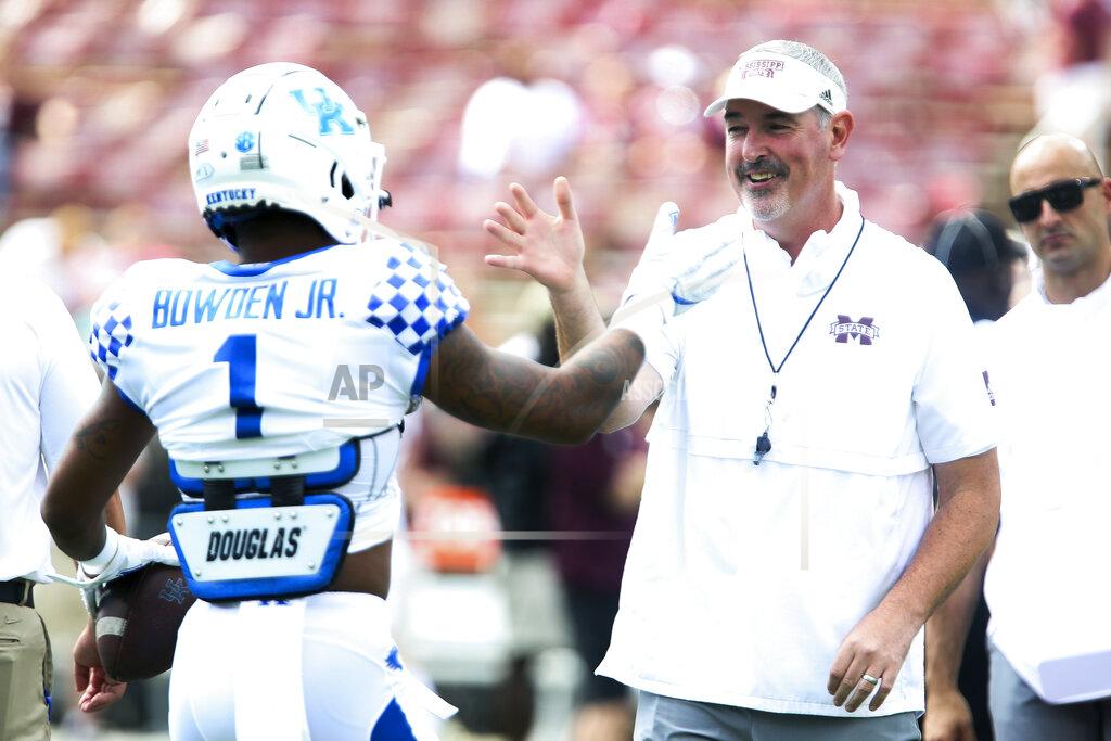 Kelly Donoho Mississippi State head coach Joe Moorhead greets Kentucky wide receiver Lynn Bowden Jr. (1) during warmups prior to an NCAA college football game, Saturday, Sept. 21, 2019, in Starkville, Miss. (AP Photo/Kelly Donoho)