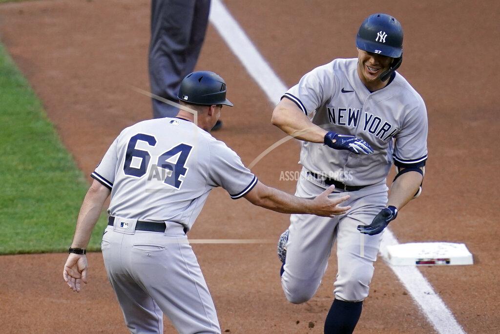 Jim Mone New York Yankees' Giancarlo Stanton, right, and third base coach Carlos Mendoza celebrate Stanton's three-run home run off Minnesota Twins' pitcher J.A. Happ during the first inning of a baseball game Thursday, June 10, 2021, in Minneapolis. (AP Photo/Jim Mone)