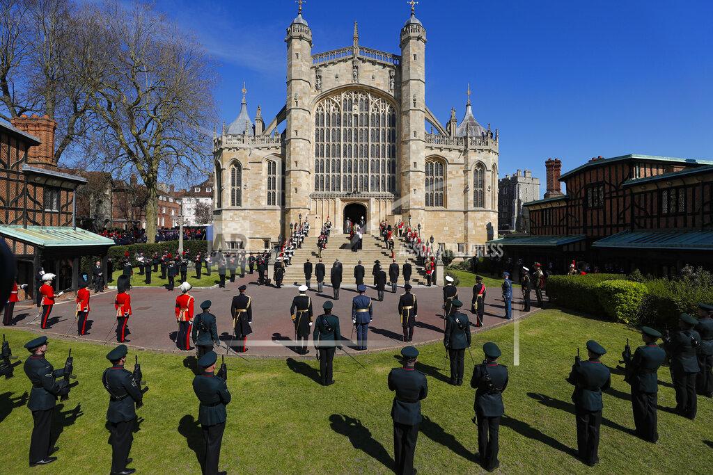 Kirsty Wigglesworth The coffin is carried inside the St George's Chapel for the funeral of Britain's Prince Philip inside Windsor Castle in Windsor, England, Saturday, April 17, 2021. (Kirsty Wigglesworth/Pool via AP)