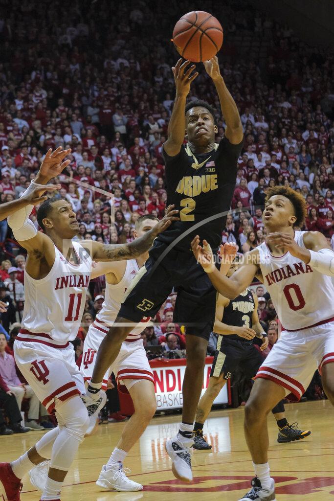 Aj Mast Purdue guard Eric Hunter Jr. (2) shoots between Indiana defenders Devonte Green (11) and Romeo Langford (0) during the first half of an NCAA college basketball game in Bloomington, Ind., Tuesday, Feb. 19, 2019. (AP Photo/AJ Mast)