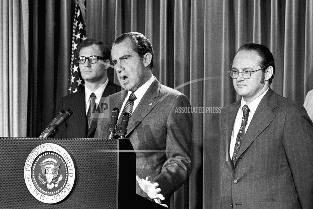 Harvey Georges FILE - In this June 17, 1971, file photo, President Richard Nixon explains aspects of the special message sent to the Congress, asking for an extra $155 million for a new program to combat the use of drugs. He labeled drug abuse "a national emergency" and said the money would be used to "tighten the noose around the necks of drug peddlers and thereby loosen the noose around the necks of drug users." At left is Egil Krogh, deputy director of the Domestic Council. At right is Dr. Jerome Jaffe, who was recruited by Nixon to lead a new drug strategy. (AP Photo/Harvey Georges, File)