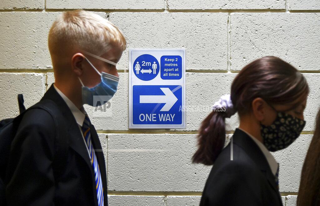 Rui Vieira FILE - In this Friday, Sept. 3, 2021 file photo, pupils at Covid test station as they entered their new secondary school for the first time at Wales High school, Sheffield, England. Britain’s chief medical officers say children ages 12 to 15 should be vaccinated against the coronavirus. England Chief Medical Officer Chris Whitty and his counterparts in Scotland, Wales and Northern Ireland, said Monday, Sept. 13 that the age group should be given a single dose of the Pfizer-BioNTech vaccine. (AP Photo/Rui Vieira, file)