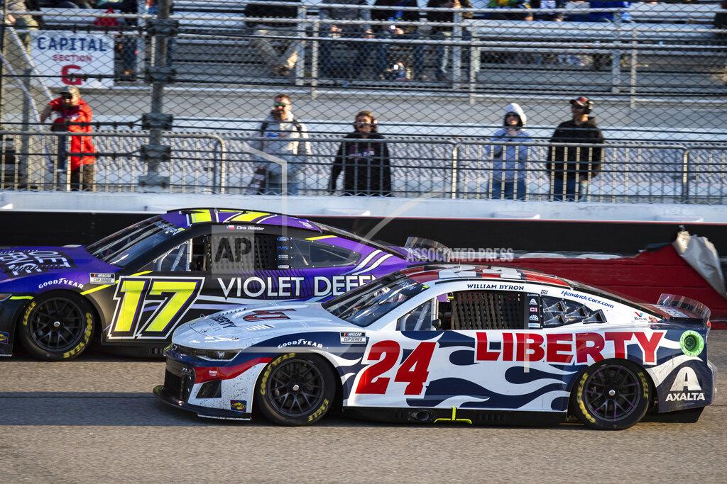 Mike Caudill William Byron (24) and Chris Buescher (17) drive during the NASCAR Cup Series auto race at Richmond Raceway on Sunday, April 3, 2022, in Richmond, Va. (AP Photo/Mike Caudill)
