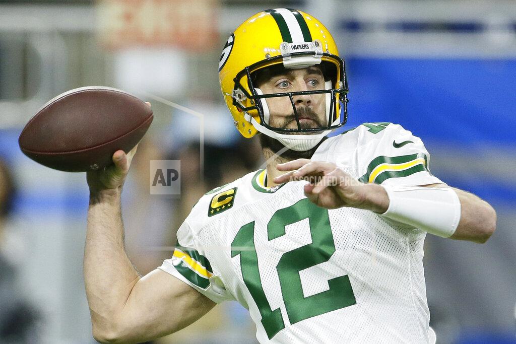 Duane Burleson FILE - In this Dec. 29, 2019, file photo, Green Bay Packers quarterback Aaron Rodgers throws during the first half of an NFL football game against the Detroit Lions, in Detroit. NFL players and coaches went home in March and stayed there for the next few months, along with most of the world. “The biggest change has been, you know, feeling like a kid throwing the football at the park,” Packers quarterback Aaron Rodgers said. (AP Photo/Duane Burleson, File)