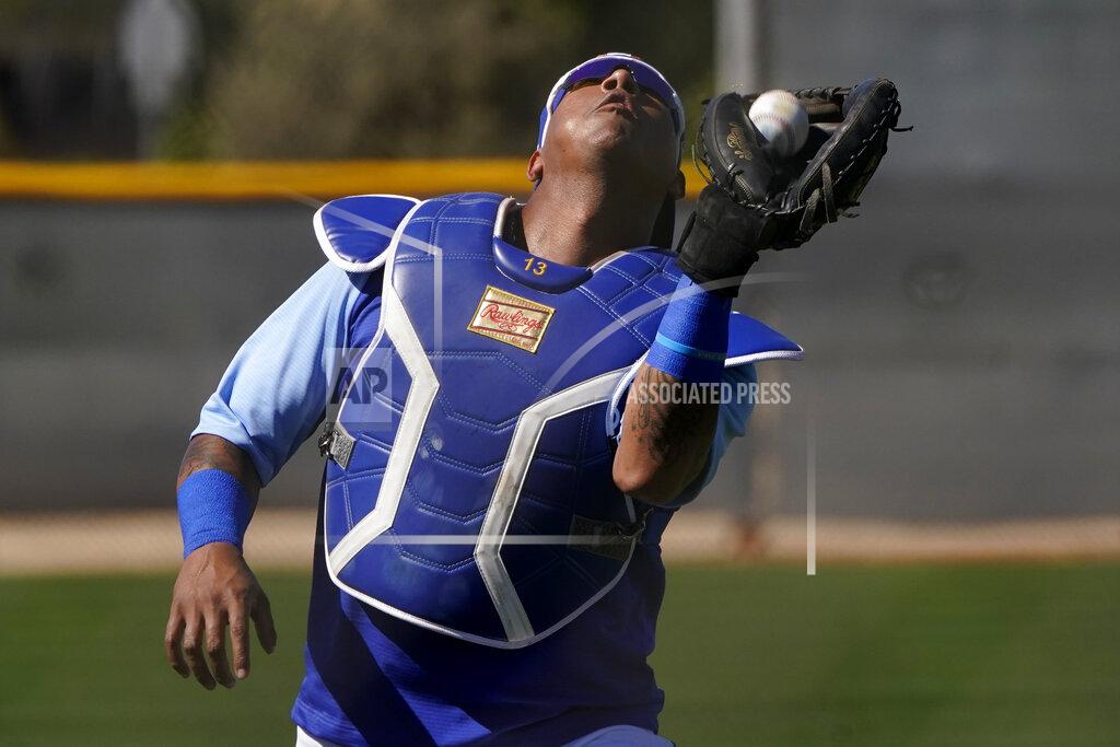 Charlie Riedel Kansas City Royals' Salvador Perez catches a ball during spring training baseball practice Wednesday, Feb. 24, 2021, in Surprise, Ariz. (AP Photo/Charlie Riedel)