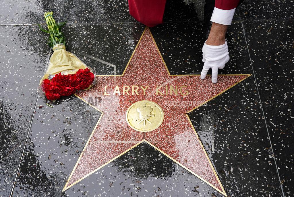 Chris Pizzello Flowers lie on the Hollywood Walk of Fame star of the late broadcasting giant Larry King, Saturday, Jan. 23, 2021, in Los Angeles. King, the host of "Larry King Live" on CNN for over 25 years, died Saturday at Cedars-Sinai Medical Center in Los Angeles. He was 87. (AP Photo/Chris Pizzello)